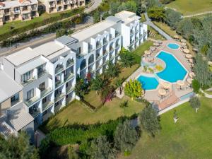 an aerial view of a resort with a swimming pool at Lindos Breeze Beach Hotel in Kiotari