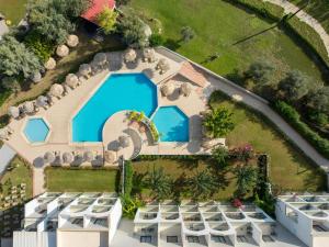 an aerial view of a resort with a swimming pool at Lindos Breeze Beach Hotel in Kiotari