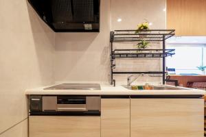 a kitchen with a sink and a stove at Nakanishiso 2F - Vacation STAY 30052v in Tokyo