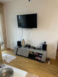 a living room with a flat screen tv on the wall at Alex Beach in Elenite