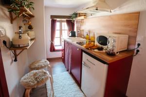 a small kitchen with a sink and a microwave at la foret in Metsovo