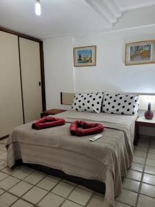 Ein Bett oder Betten in einem Zimmer der Unterkunft Apto Ponta Verde - Sol e Mar