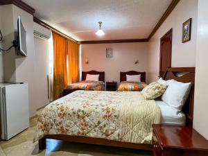 Letto o letti in una camera di Hotel Bucaneiro