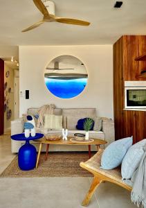 a living room with a couch and a table at ZAMA Bella Vista - Swimming pool - AC in Acantilado de los Gigantes