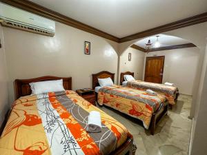 Letto o letti in una camera di Hotel Bucaneiro