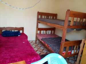 a bedroom with two bunk beds and a bed at Sam & Miriam's Homestay in Nakuru