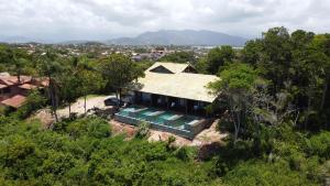 an aerial view of a house in the trees at Pousada Rosa Norte in Imbituba