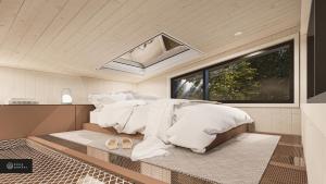 a bedroom with a bed with white sheets and slippers at MiniBora Le moka - Cantons-de-l'Est in Bury