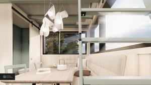 jadalnia ze stołem i oknem w obiekcie MiniBora Le marin - Cantons-de-l'Est w mieście Bury
