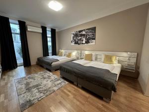 Кровать или кровати в номере Hotel Brauhof Wien