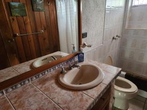 a bathroom with a sink and a toilet at CASA XOCOMIL in Cerro de Oro