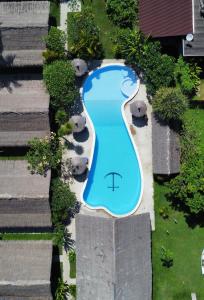 an overhead view of a swimming pool in a yard at Captain Goodtimes in Gili Islands