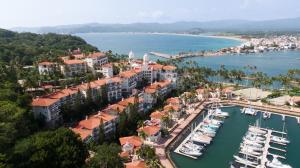 uma vista aérea de um porto com barcos em Grand Isla Navidad Golf & Spa Resort with Marina em Barra de Navidad