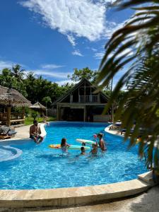 a group of people in a swimming pool at Captain Goodtimes in Gili Islands