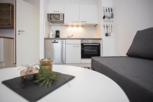 a living room with a bed and a kitchen at Appartement Brink Am Waltenberg 57-59 in Winterberg