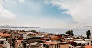 a city with buildings and the water in the background at Skalion Hotel & SPA in Istanbul