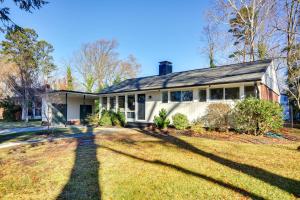 a house with a large lawn in front of it at Laptop-Friendly Greensboro Home with Fireplace! in Greensboro