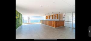 a large kitchen with a view of the ocean at Salguero suites resort in Gaira