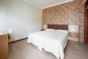 Postel nebo postele na pokoji v ubytování Hostal Campo Nuevo