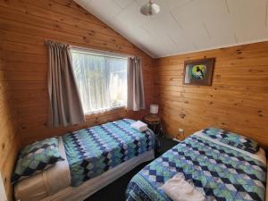 Voodi või voodid majutusasutuse Off The Beaten Trail Acc & Bike Tours toas