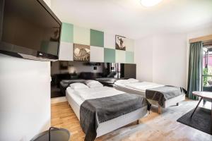 Кровать или кровати в номере Hotell Heden - BW Signature Collection