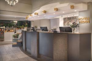 a lobby with a hotel kitchen with a reception counter at Hotell Heden - BW Signature Collection in Gothenburg