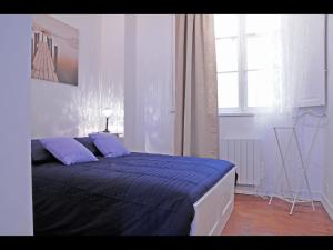 Cama o camas de una habitación en Bordeaux charming center