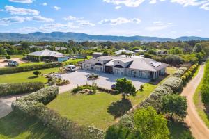 an aerial view of a house with a yard at Mudgee Guesthouse in Mudgee