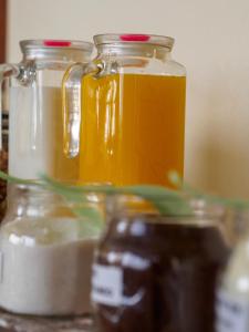 a group of jars of honey and other food items at Refugio del Turista in Tupiza