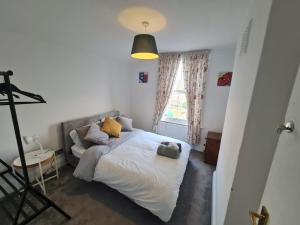 a bedroom with a bed and a window at 3-Bed House in London self-contained in Ladywell in London