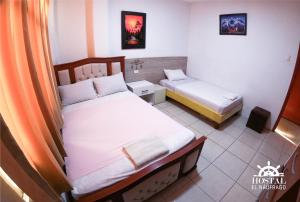 Postel nebo postele na pokoji v ubytování Hostal El Naufrago 1