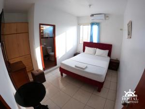 Postel nebo postele na pokoji v ubytování Hostal El Naufrago 1