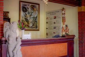 a sign on a wall with at Garden View Ubud in Ubud