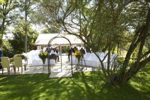 a gazebo with a table set up for a wedding at North Haven Country Estate in Honeydew