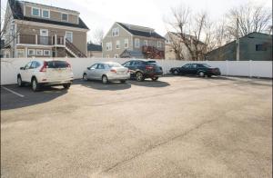 a group of cars parked in a parking lot at Comfort Stay in Boston