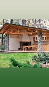 a house with a patio with a fireplace at Karolingerweg in Lauterhofen