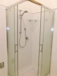 a shower with a glass enclosure in a bathroom at Appartamento La Dimora Siciliana in Trapani