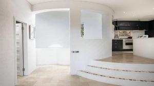 A kitchen or kitchenette at Panoramic Ocean Views and Short Walk To Beach