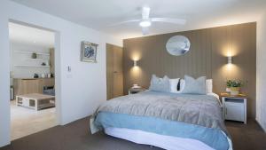 A bed or beds in a room at Panoramic Ocean Views and Short Walk To Beach