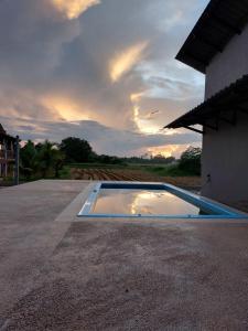 a swimming pool on the side of a house at Freesia Haus in Kota Bharu