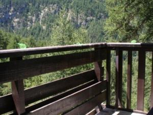 a wooden balcony with a view of a mountain at Appartement Les Orres, 2 pièces, 6 personnes - FR-1-322-585 in Les Orres