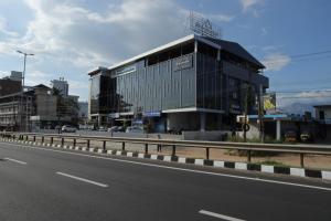 a large building on the side of a road at Dreamotel Luxury Suites in Kanjikode