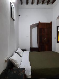 Postel nebo postele na pokoji v ubytování Heritage Home, Hampe's