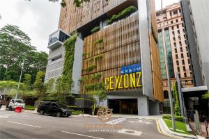 a building with a sign on the side of a street at Ceylonz Suite, Bukit Bintang, Experience in Kuala Lumpur