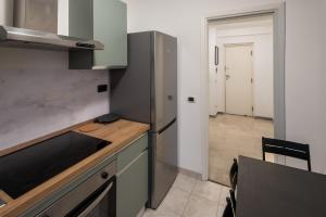a kitchen with a sink and a counter top at Eur - Penthouse in Rome