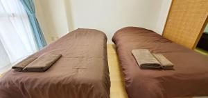 Ένα ή περισσότερα κρεβάτια σε δωμάτιο στο 札幌市中心部大通公園まで徒歩十分観光移動に便利なロケーションh203#2