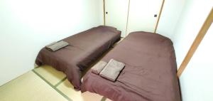 Ένα ή περισσότερα κρεβάτια σε δωμάτιο στο 札幌市中心部大通公園まで徒歩十分観光移動に便利なロケーションh203#2 +31 φωτογραφίες