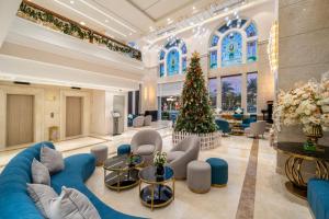 a christmas tree in the lobby of a hotel at BlueSun Danang Beach Hotel in Da Nang