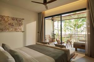 a bedroom with two beds and a balcony at The Retreat, Koh Chang in Ko Chang