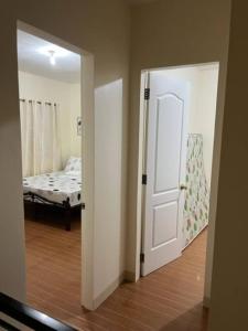 Postel nebo postele na pokoji v ubytování ESTILO APARTMENT 2-storey
